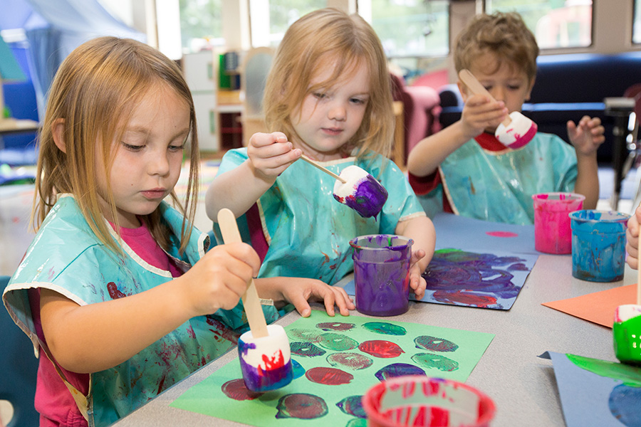 Kids painting in program at the Clinic