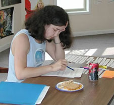 Woman sitting at a desk reading